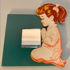 Decorative mirror with a charming vintage flair.